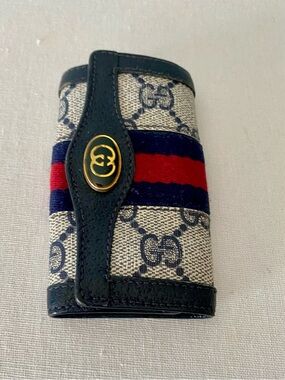 Gucci key case with navy and red stripe